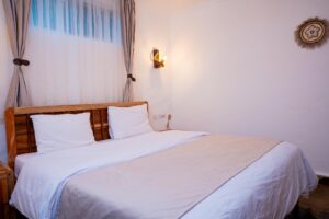 King-size bed and bedside lighting at Villa Buffalo Downstairs