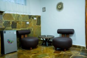 Kitchenette seating area with fridge at Villa Buffalo Downstairs