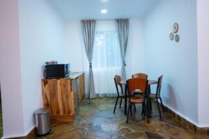 Dining area and wooden sideboard at Villa Buffalo Upstairs