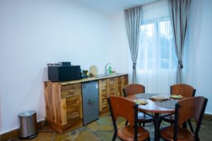 Dining table and kitchenette at Villa Buffalo Upstairs