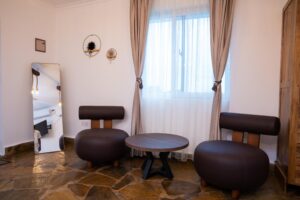 Bedroom seating area and dressing mirror at Villa Buffalo Upstairs