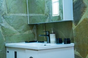 Stone-finished bathroom vanity at Villa Buffalo Upstairs