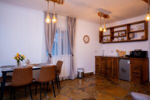 Open-plan kitchenette and dining area at Villa Komba Upstairs