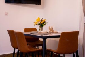Dining table with floral arrangement at Villa Komba Upstairs