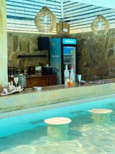 Swim-up pool bar with drinks fridge at Coast Sun Gardens