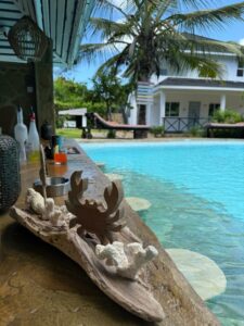 Decorative seashell display beside the swimming pool