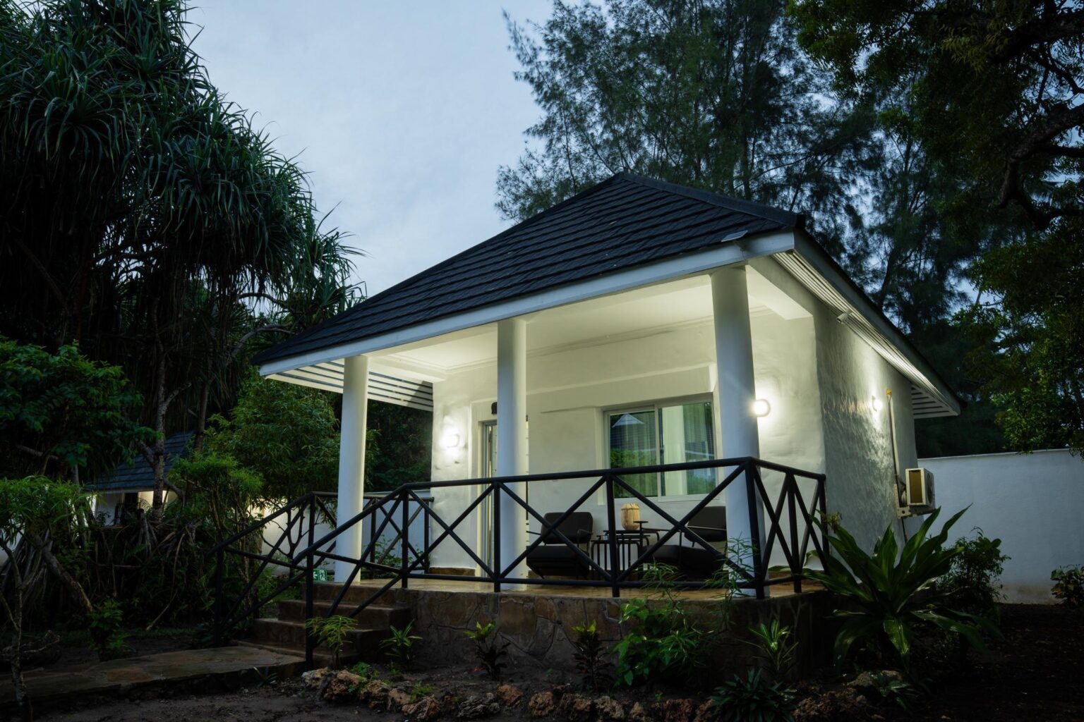 House Rhino exterior and private terrace at dusk