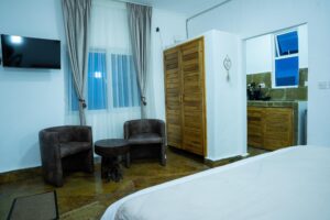 Bedroom seating and kitchenette entrance at House Rhino