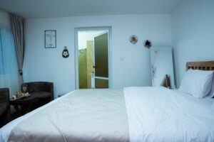 King-size bedroom with private bathroom entrance at House Tembo