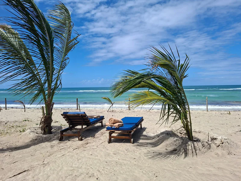 Private beach area with sun loungers and an Indian Ocean view at Coast Sun Gardens